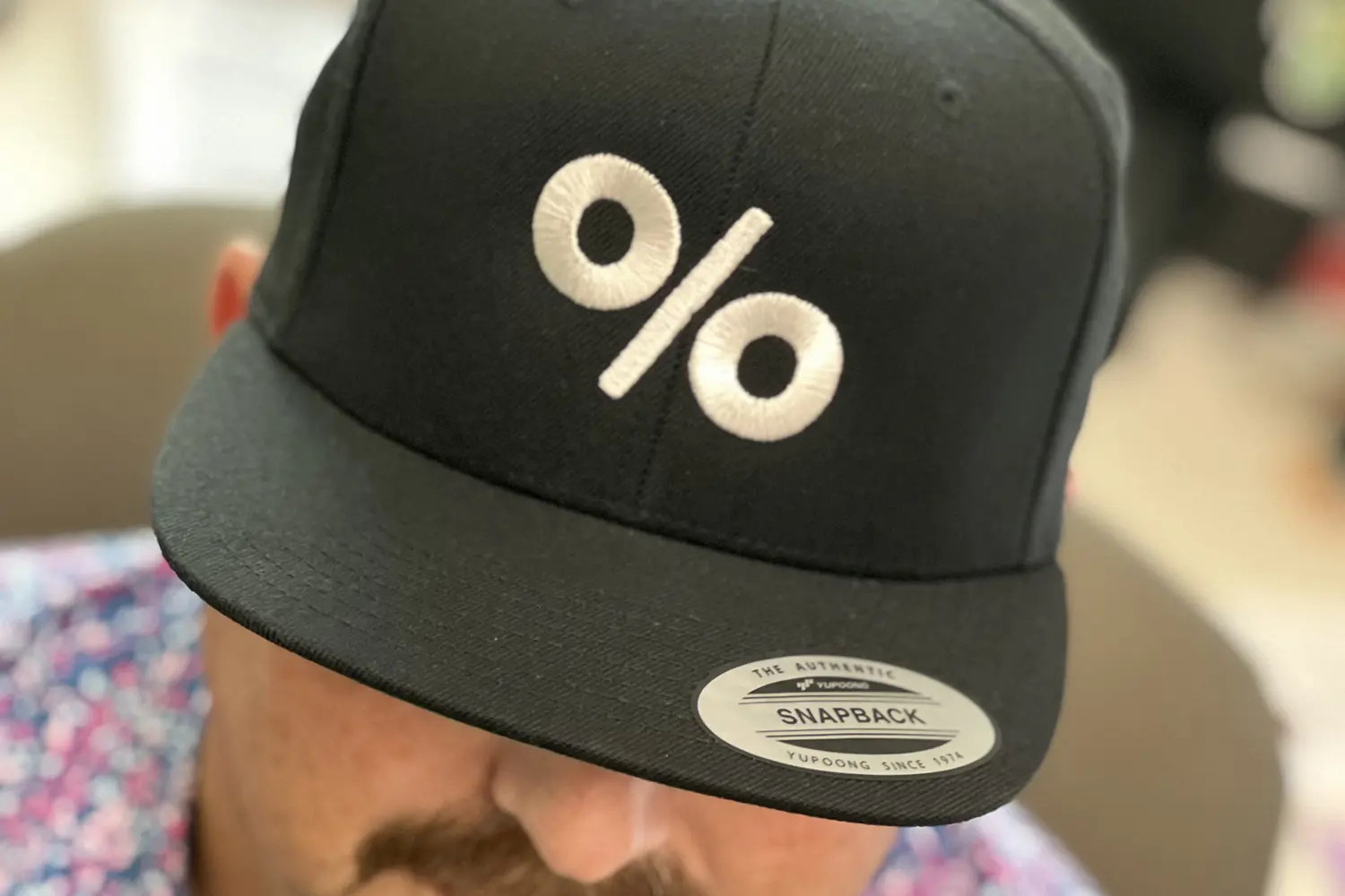 Embroidered baseball cap with company logo